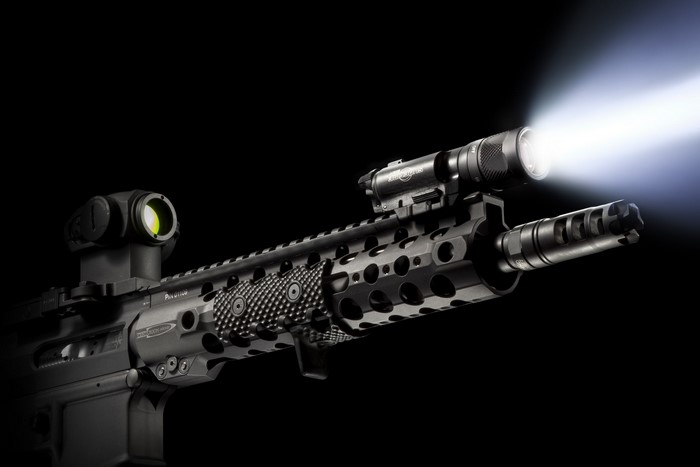 Centurion rifle with tactical flashlight and red dot sight