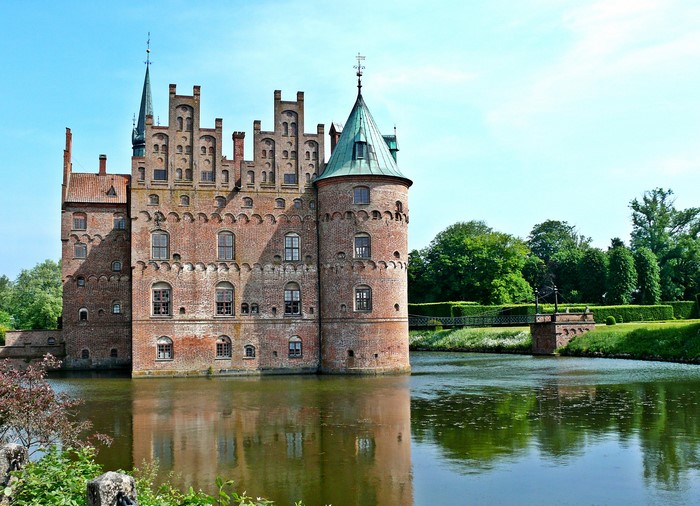 Egeskov Castle in Denmark over a pond