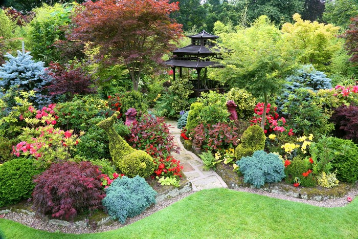 Japanese garden with pagoda and sculpted shrubs