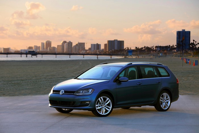 Blue 2015 Volkswagen Golf SportWagen on beach