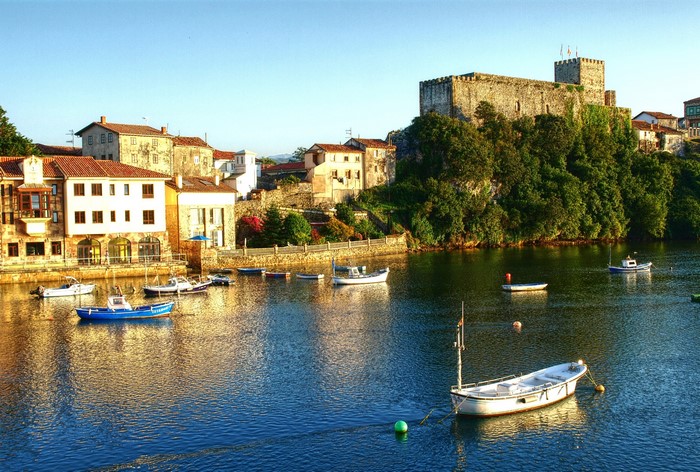 San Vicente de la Barquera, Spain with castle and boats