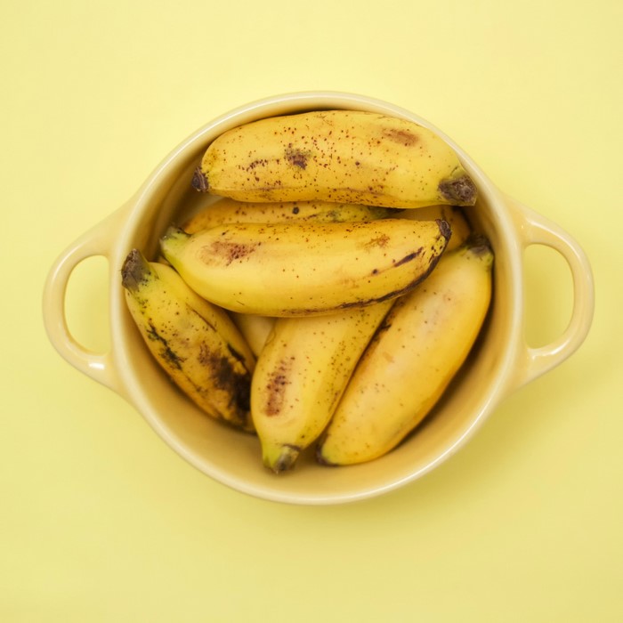 Bananas in a yellow bowl