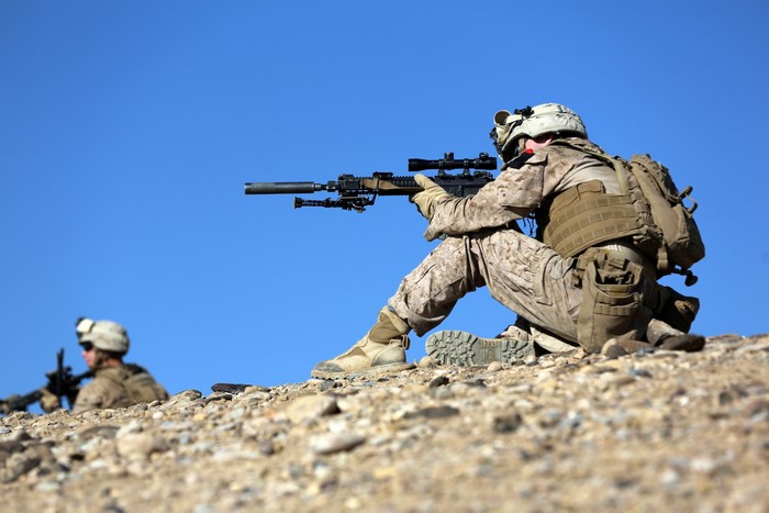 Soldiers with Rifles in Desert