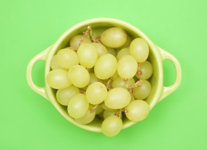 Green grapes in a light green bowl