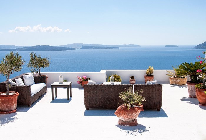 Terrace with sofas and sea view in Santorini, Greece