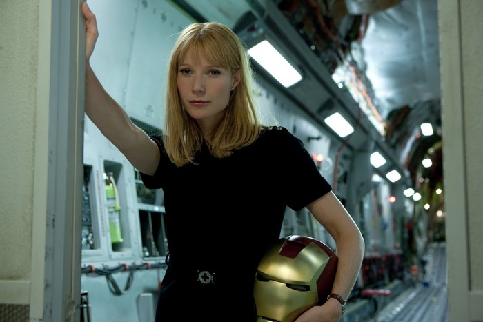 Pepper Potts from Iron Man holding Iron Man helmet