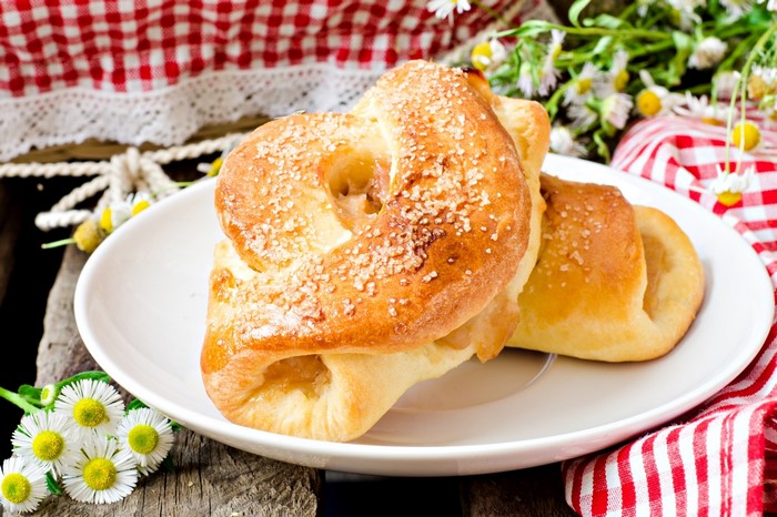 Sweet pastries with sugar on a white plate