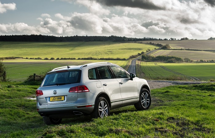 Silver Volkswagen Touareg in a rural landscape