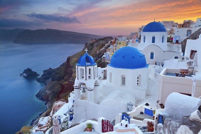 Santorini Greece blue domed churches at sunset