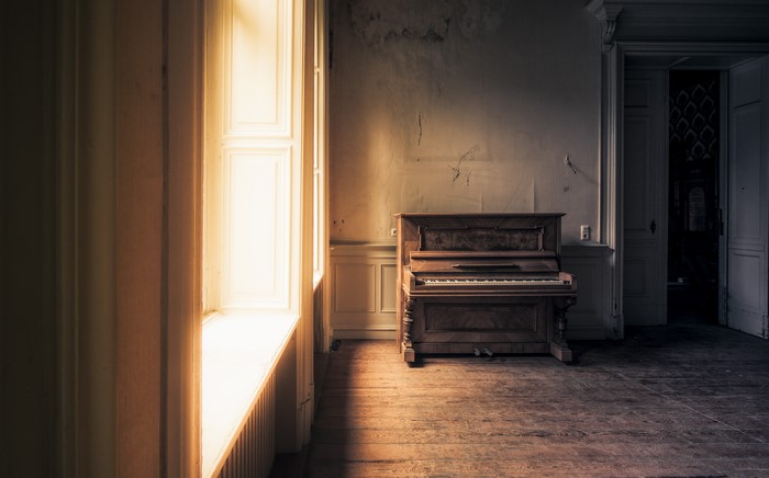 Piano in an abandoned room