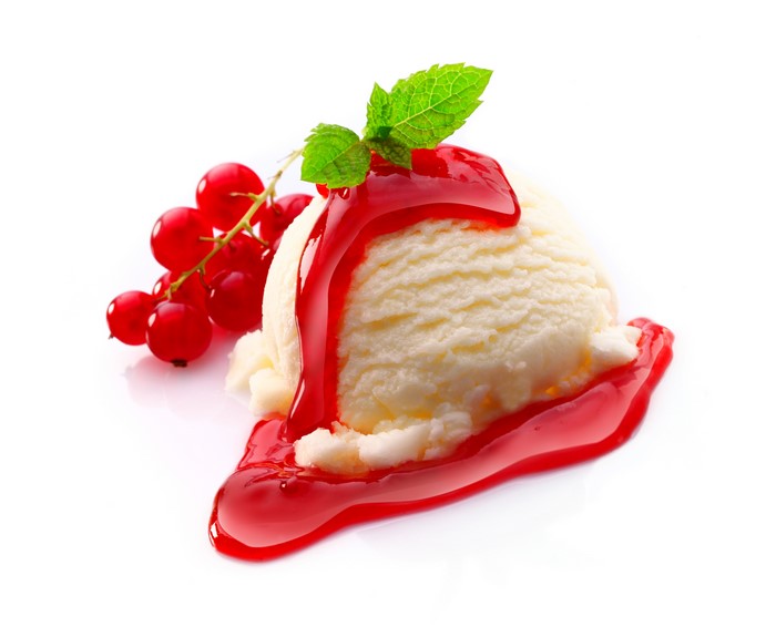 Ice cream scoop with red currant and mint