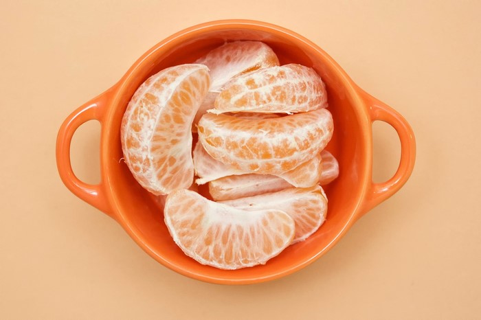 Peeled Mandarin Orange Segments in Orange Bowl