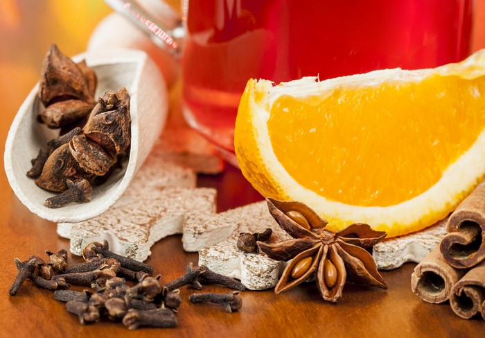 Spices and Orange Slice with Red Drink