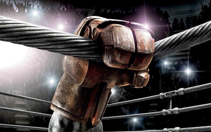 Robot fist gripping a cable in a boxing ring