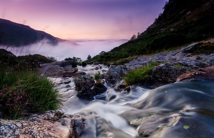 River flowing through mountains at sunrise in the UK