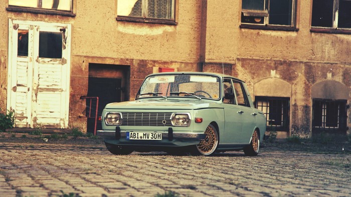 Vintage Wartburg car parked on cobblestone street