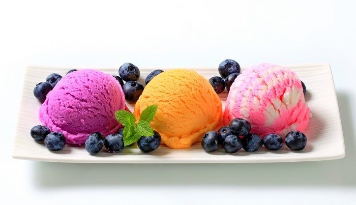 Three scoops of ice cream with blueberries