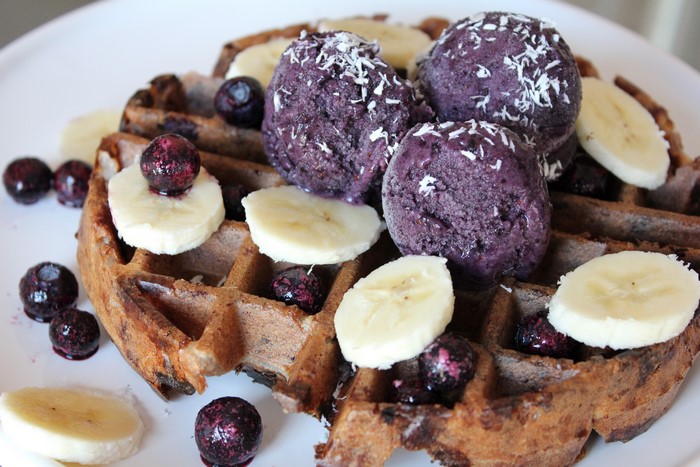 Waffles with ice cream, bananas, and blueberries