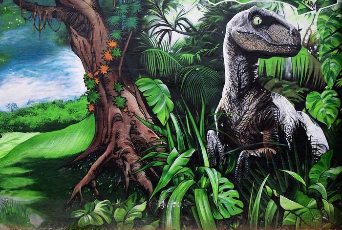Graffiti of a dinosaur in a jungle