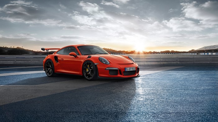 Orange Porsche 911 GT3RS on a Racetrack