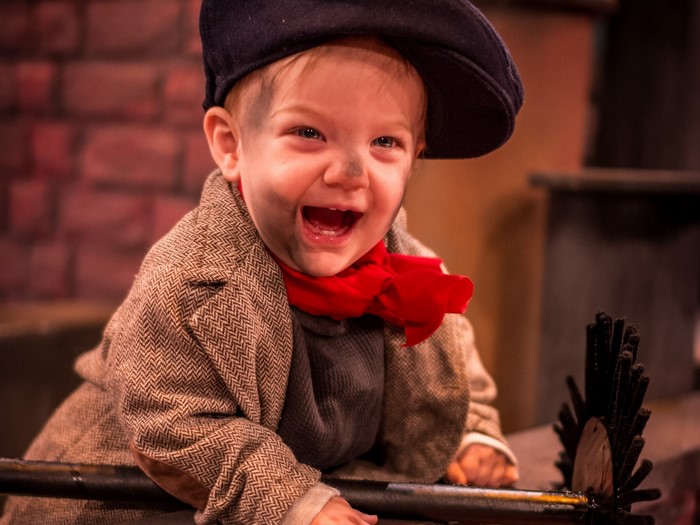 Baby in costume with soot on face