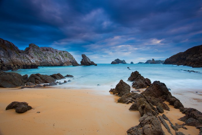 Rocky Cove Beach with Dramatic Clouds