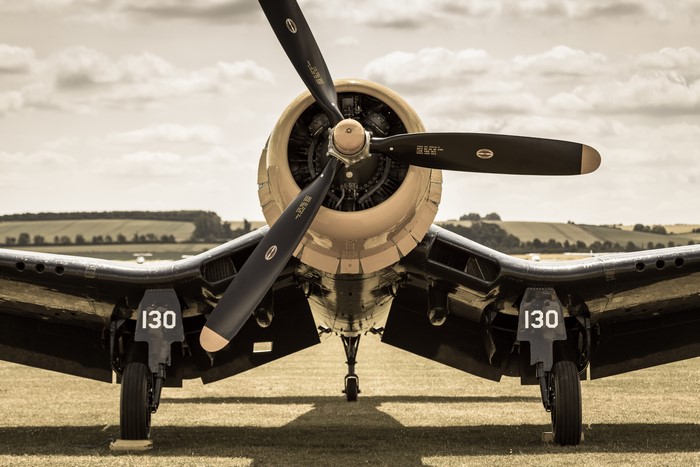 F4U Corsair fighter airplane on a grassy field