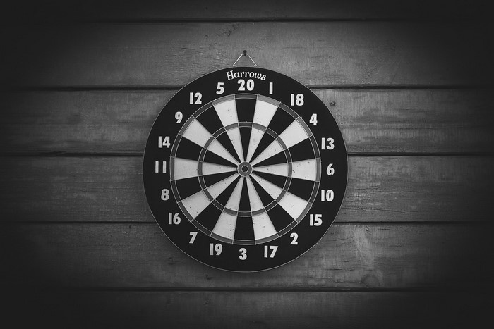 Harrows dartboard on wooden wall
