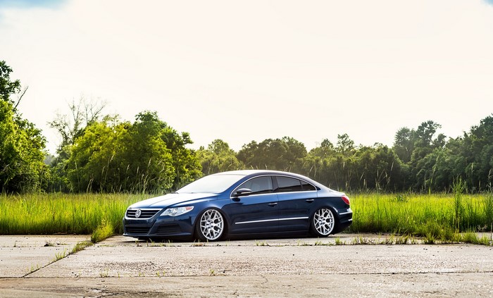 Blue Volkswagen Passat CC on a road