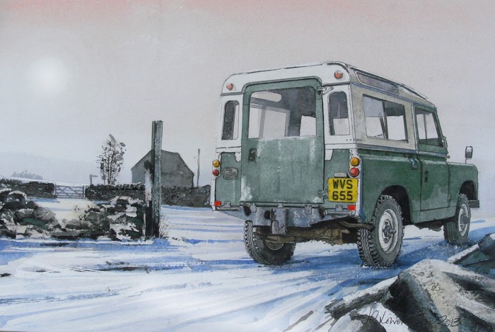Green Land Rover in a Snowy Landscape