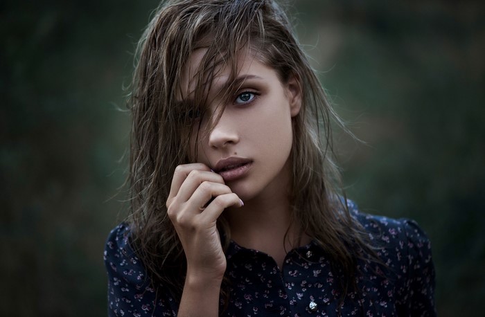 Woman with wet brown hair and blue eyes
