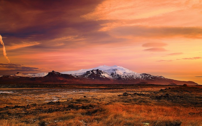 Snow-capped mountains in Iceland at sunset