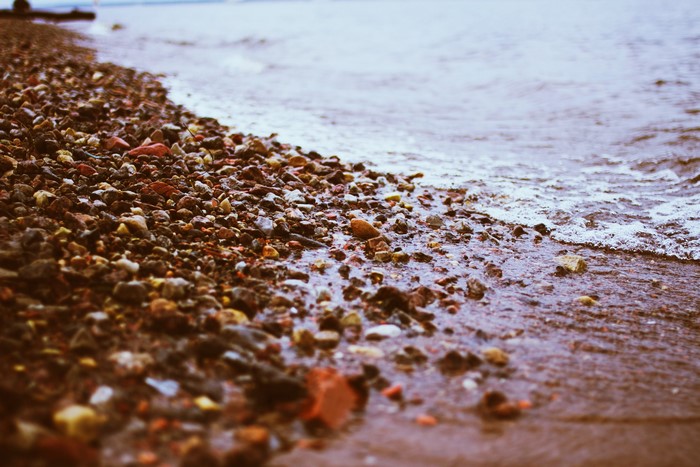 Pebble beach with gentle waves