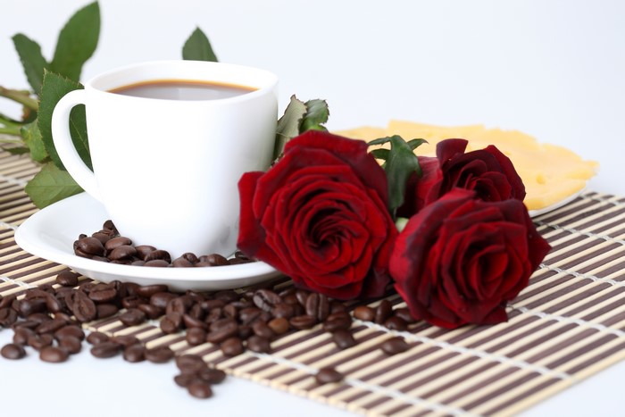 Coffee cup with red roses and cheese
