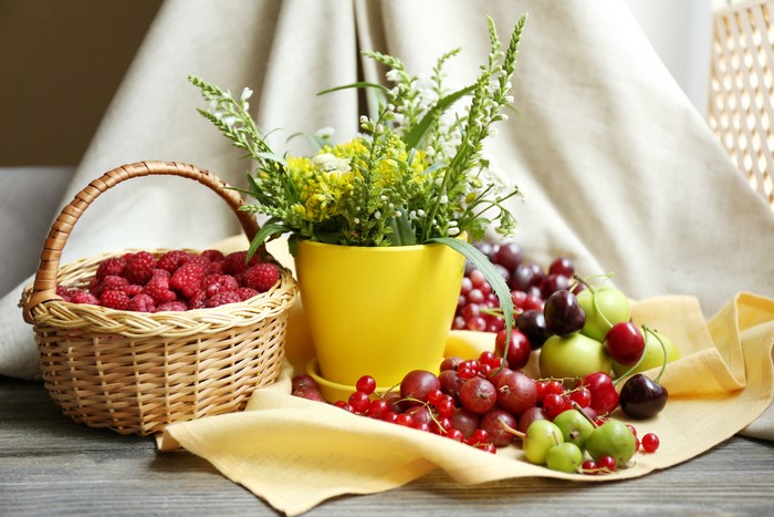 Still-life with raspberries, currants, cherries, and flowers