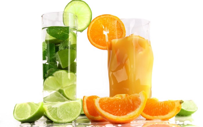 Orange juice and lime drink with fruit slices