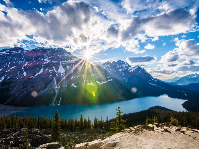 Sunlight over Mountains and Lake in Banff National Park