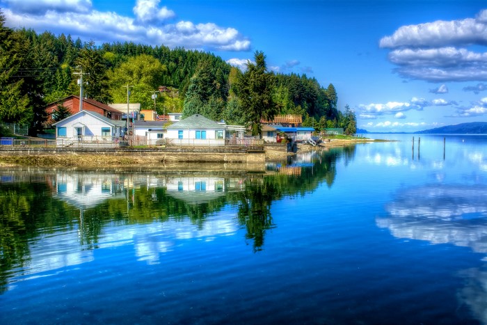 Houses on the waterfront in Hoodsport, Washington with reflections