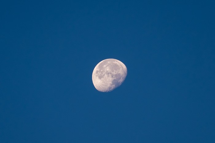 The Moon in a clear blue sky