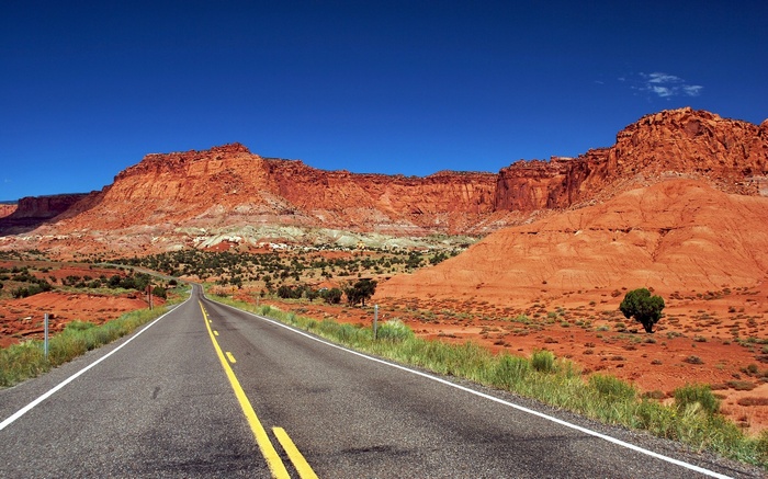 Desert Road Leading to Red Rock Mountains