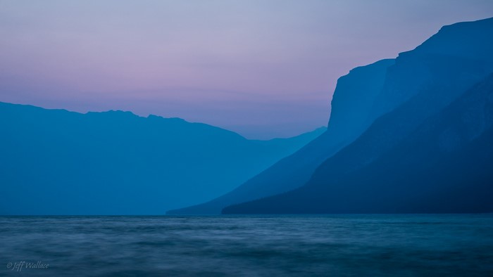 Mountains and sea at dusk with purple sky