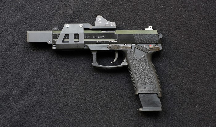Heckler & Koch USP Tactical .45 Auto pistol with red dot sight