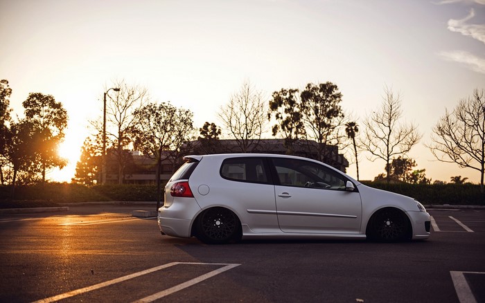 White Volkswagen Golf MK5 GTI parked at sunset