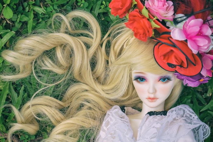 Doll with blonde hair and flowers