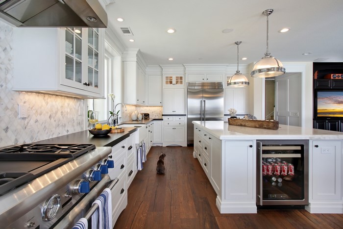Modern White Kitchen with Stainless Steel Appliances and Island