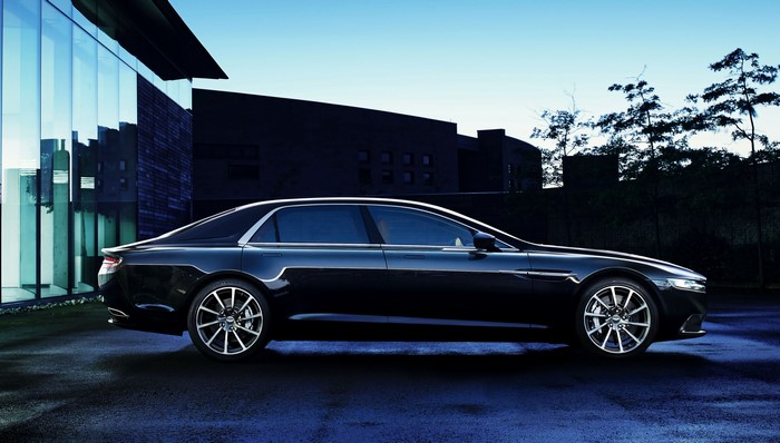 Black Aston Martin Lagonda parked outside modern building