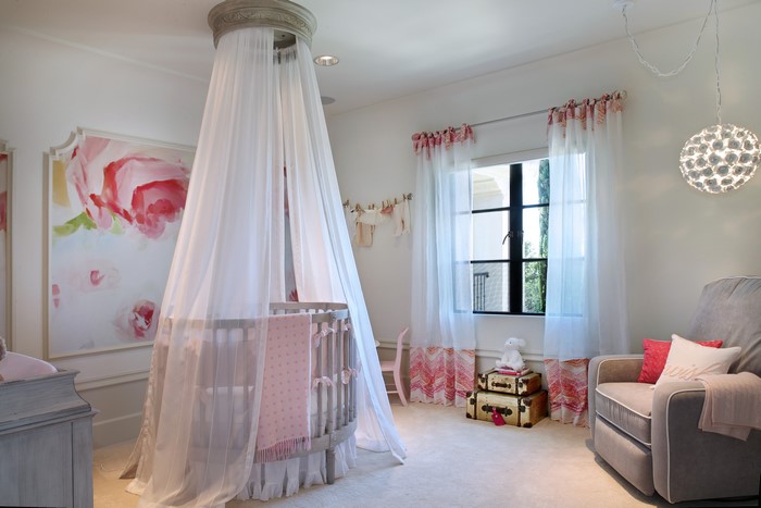Nursery with floral mural and crib
