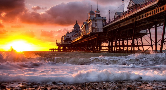 Pier at Sunset with Waves