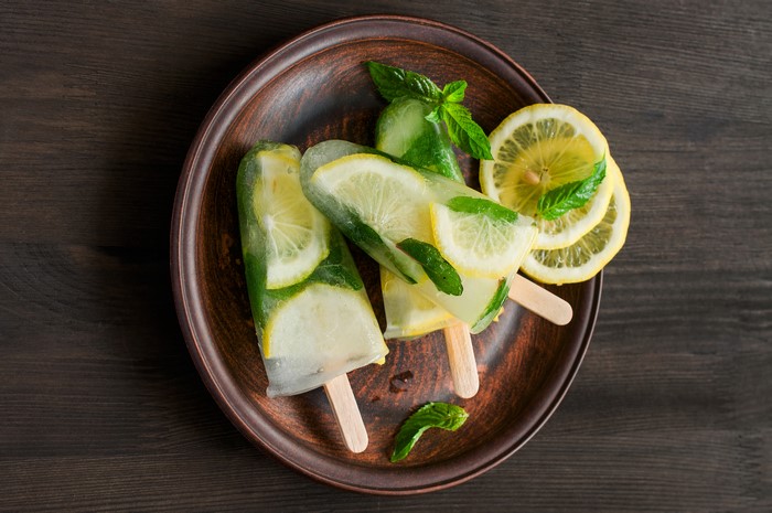 Lemon and mint popsicles on a plate