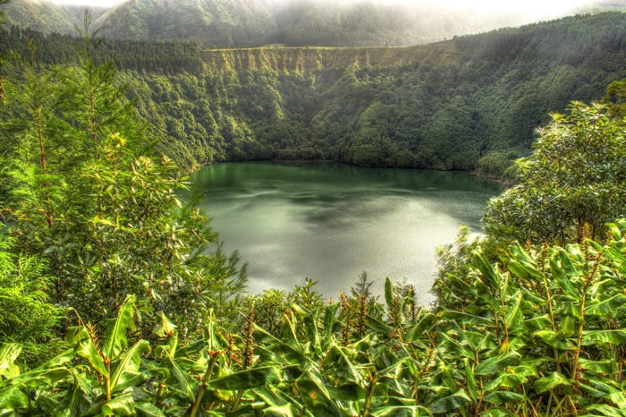 Lagoa de Santiago lake surrounded by forests in Portugal